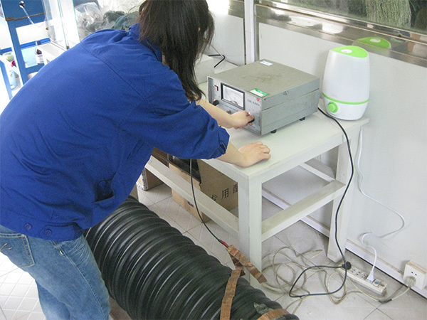 Testing personnel are recording the pressure impact test on the product